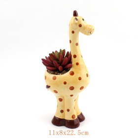 uroczy ceramiczne doniczka żyrafa wypełniona kwiatami